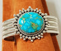 Photo of Bracelet made of 3 pieces twist silver between 4 pieces of plain silver.  Band is topped with Sonoran Gold Turquoise that is surrounded with various size handmade silver beads.
