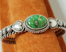 Photo of Bracelet made of 2 piece twist silver band topped with Sonoran Gold Turquoise surrounded with silver twist wire