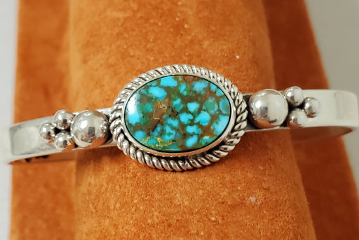 Photo of Bracelet made of plain silver band topped with Kingman Turquoise  with silver beads  on sides