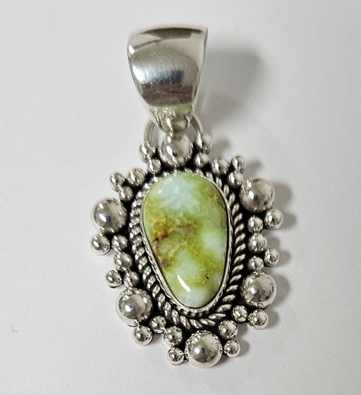 Photo of jewelry by Artie Yellowhorse