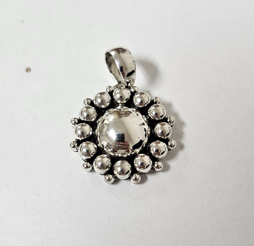 Photo of jewelry by Artie Yellowhorse