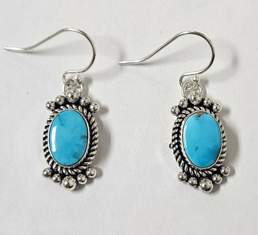 Photo of jewelry by Artie Yellowhorse