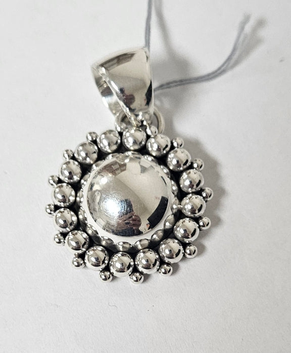 Photo of jewelry by Artie Yellowhorse