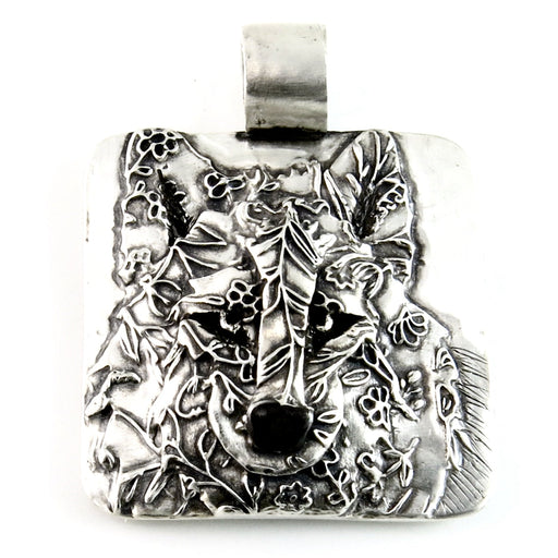 Photo of silver pendant by Kris Kramer