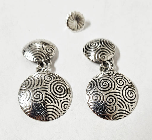 Photo of silver earring by Artie Yellowhorse