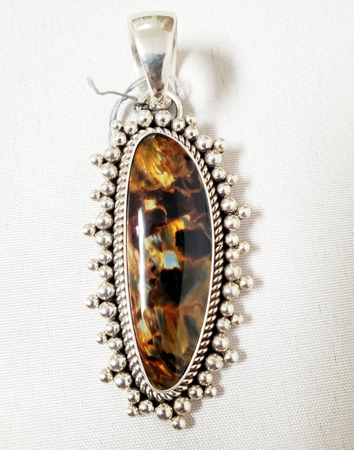 Photo of Pietersite pendant with silver twist wire and handmade beads by Artie Yellowhorse