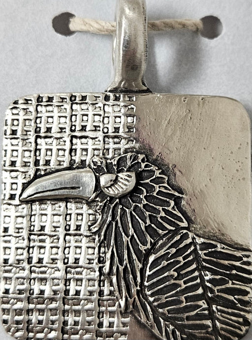 Photo of silver pendant by Kris Kramer