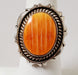 Photo of Oval Orange Spiny Oyster Shell and silver ring by Artie Yellowhorse