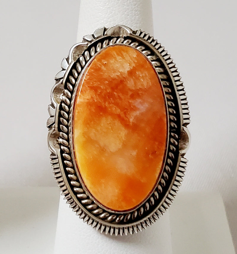 Photo of Oval Orange Spiny Oyster Shell and silver ring by Artie Yellowhorse