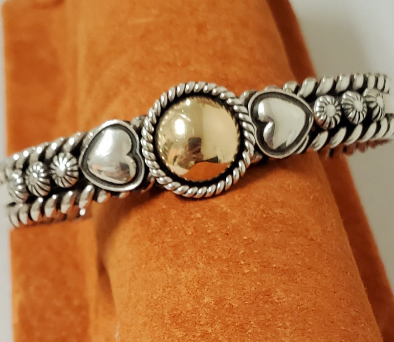 photo of silver cuff with 14k gold dome center