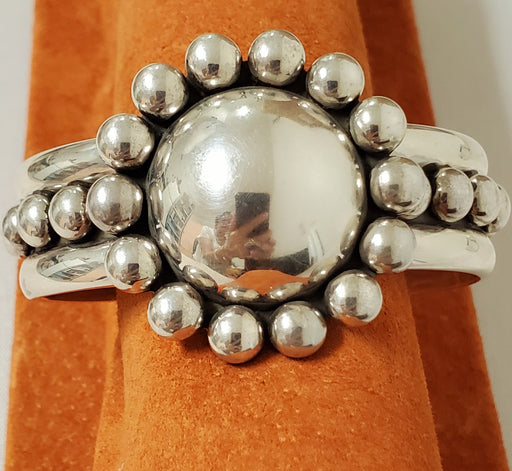 Photo of wide silver cuff topped with Large dome and silver beads by Artie Yellowhorse