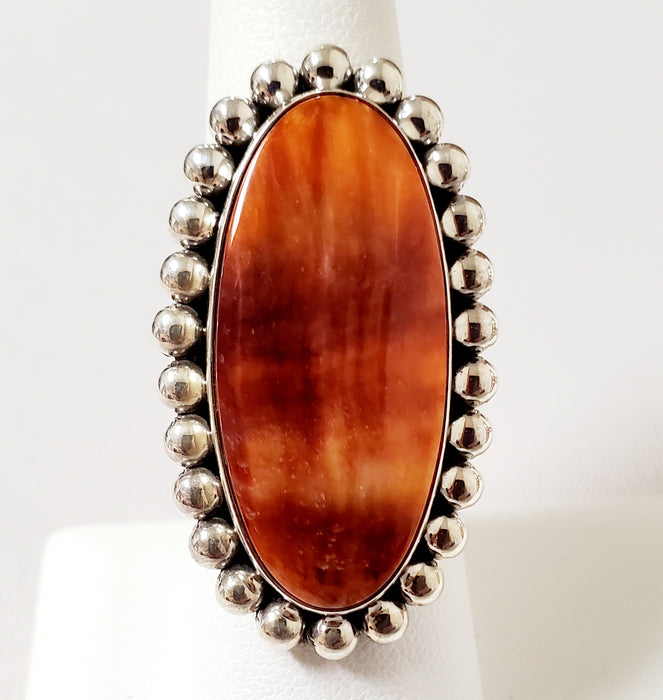 Photo of Oval Red/Orange Spiny Oyster Shell and silver ring by Artie Yellowhorse