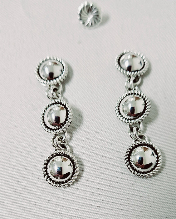 Photo of silver earrings by Artie Yellowhorse