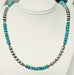 A beaded necklace turquoise-blue round beads alternating with silver 