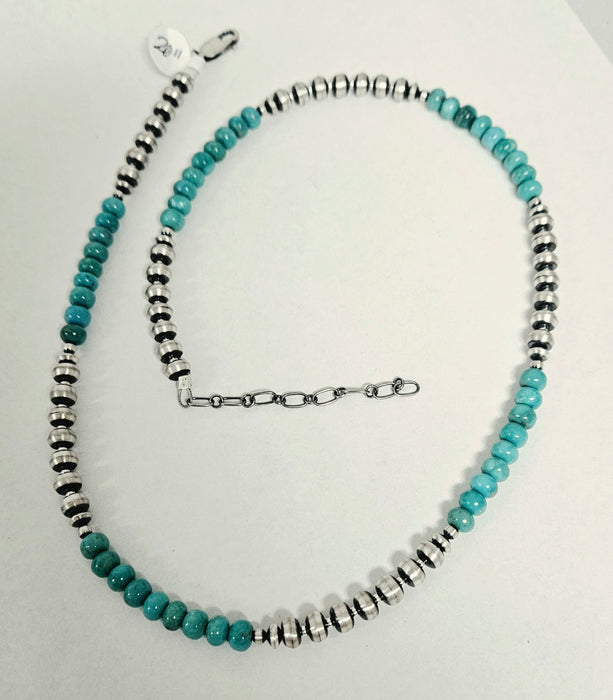 A beaded necklace turquoise-blue round beads alternating with silver 