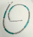 A beaded necklace turquoise-blue round beads alternating with silver 